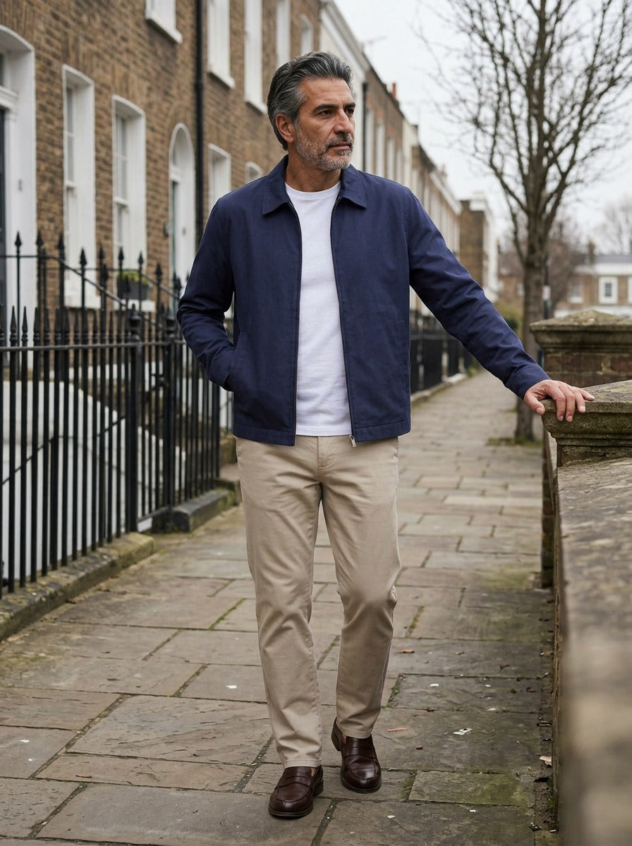Goodwin jacket in Navy, lifestyle on a street of brick row houses, Gentlemens Manor