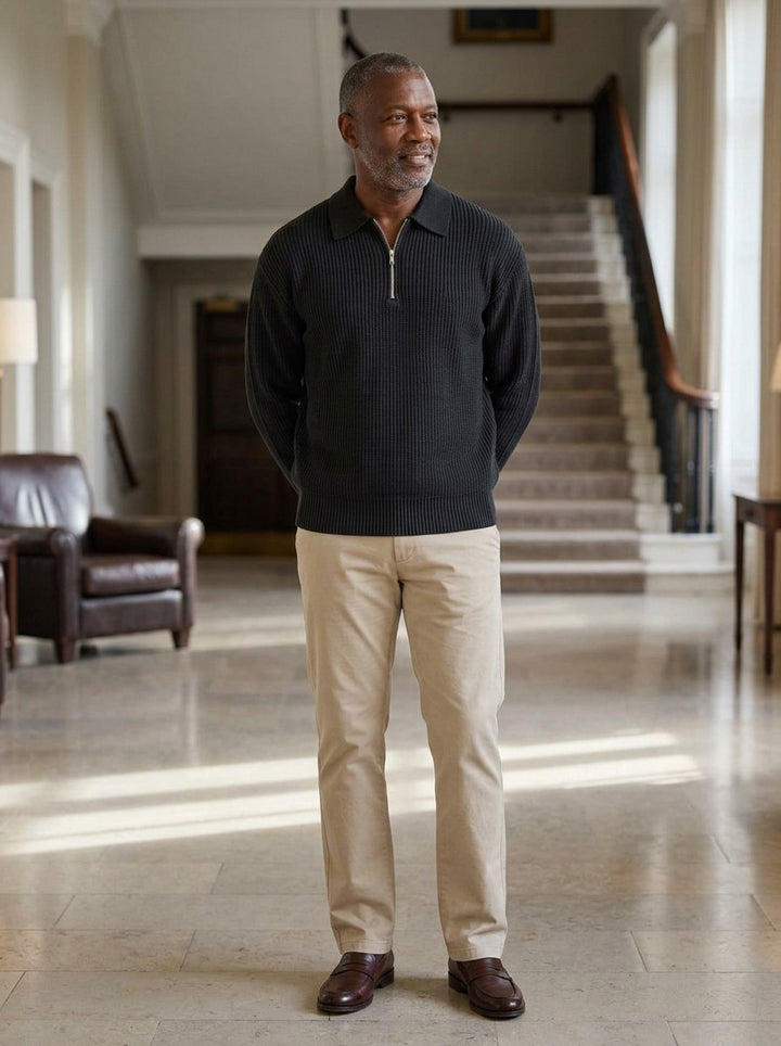 Grafton half zip sweater in Black, lifestyle in a hotel lobby, Gentlemens Manor