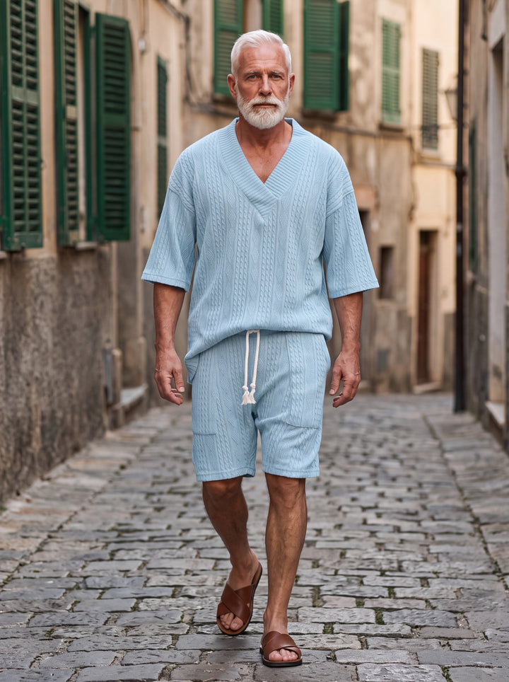 Grant Men two-piece summer set in light blue, worn by a model in a Mediterranean setting - Gentlemens Manor lifestyle