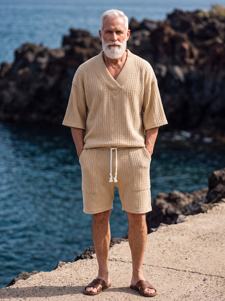 Grant Men two-piece summer set in sand, worn by a model in a Mediterranean setting - Gentlemens Manor lifestyle