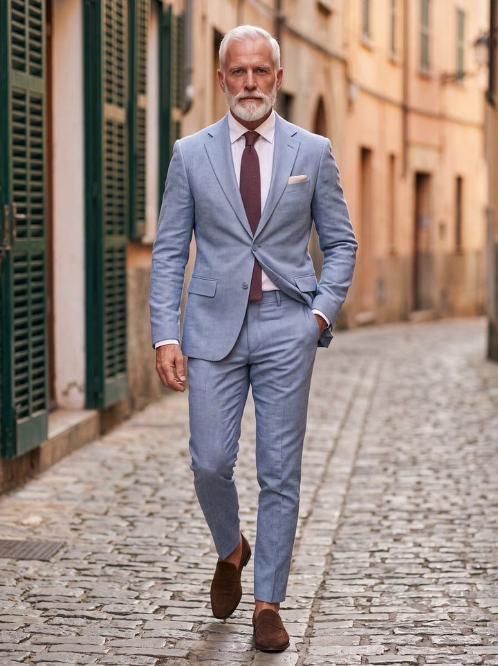 Granville Men two-piece suit in light blue, worn by a model in a Mediterranean setting - Gentlemens Manor lifestyle