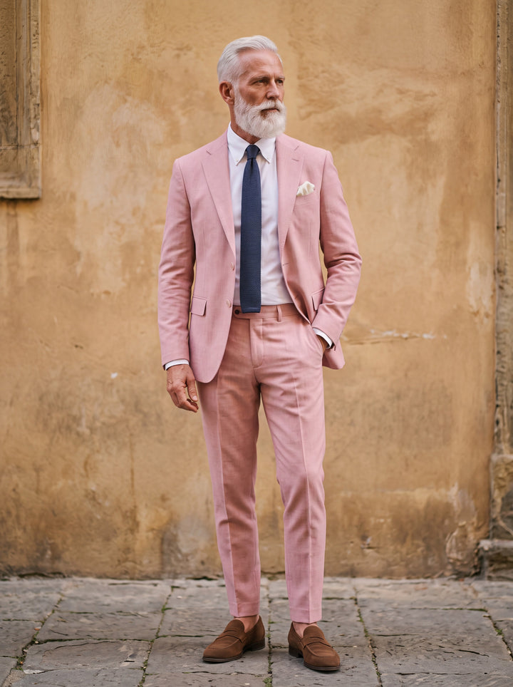 Granville Men two-piece suit in pink, worn by a model in a Mediterranean setting - Gentlemens Manor lifestyle