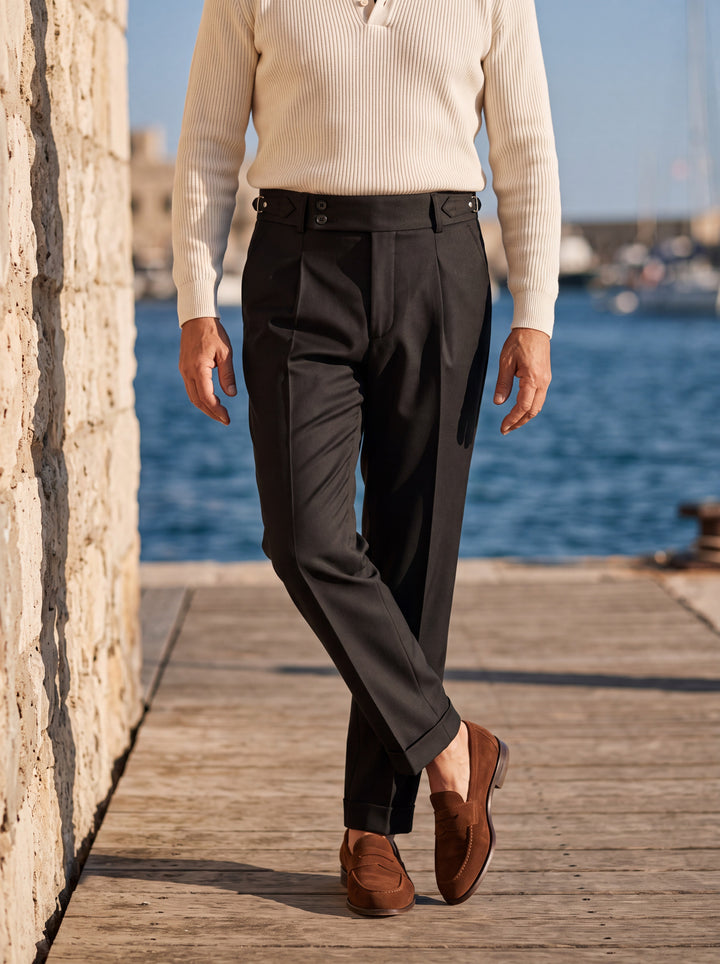 Grayson trousers in Black, worn by a model in a Mediterranean setting - Gentlemens Manor lifestyle