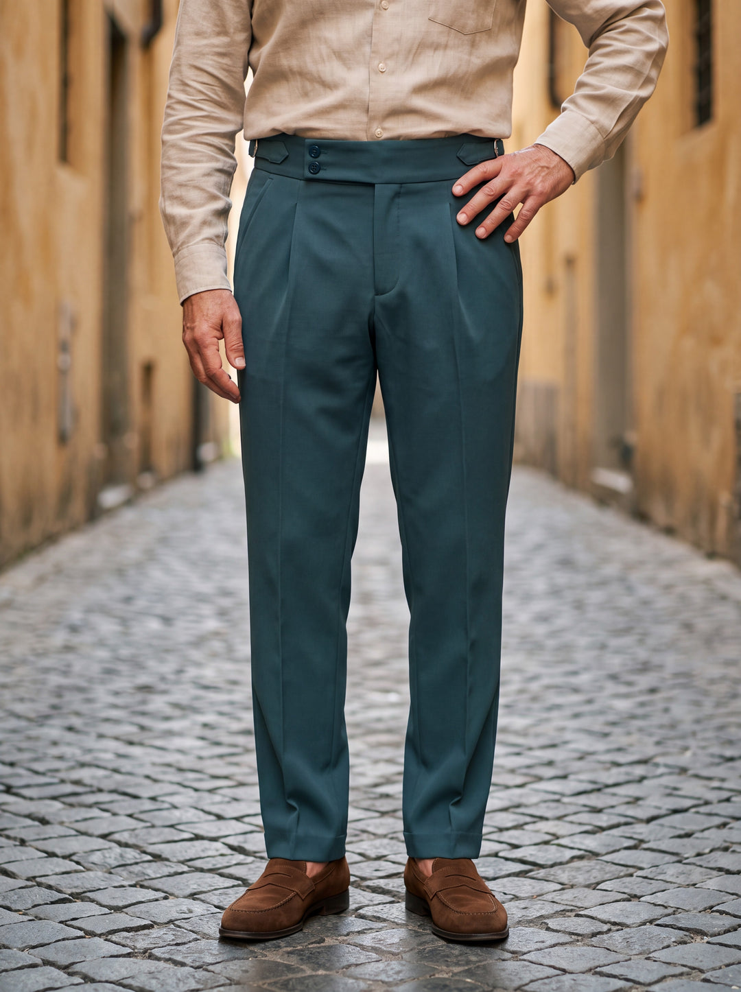 Grayson trousers in Green, worn by a model in a Mediterranean setting - Gentlemens Manor lifestyle