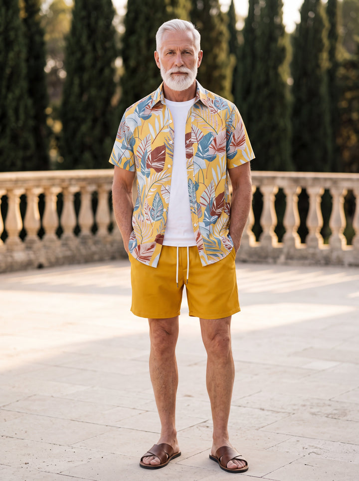 Griffin Men two-piece summer set in mustard, worn by a model in a Mediterranean setting - Gentlemens Manor lifestyle