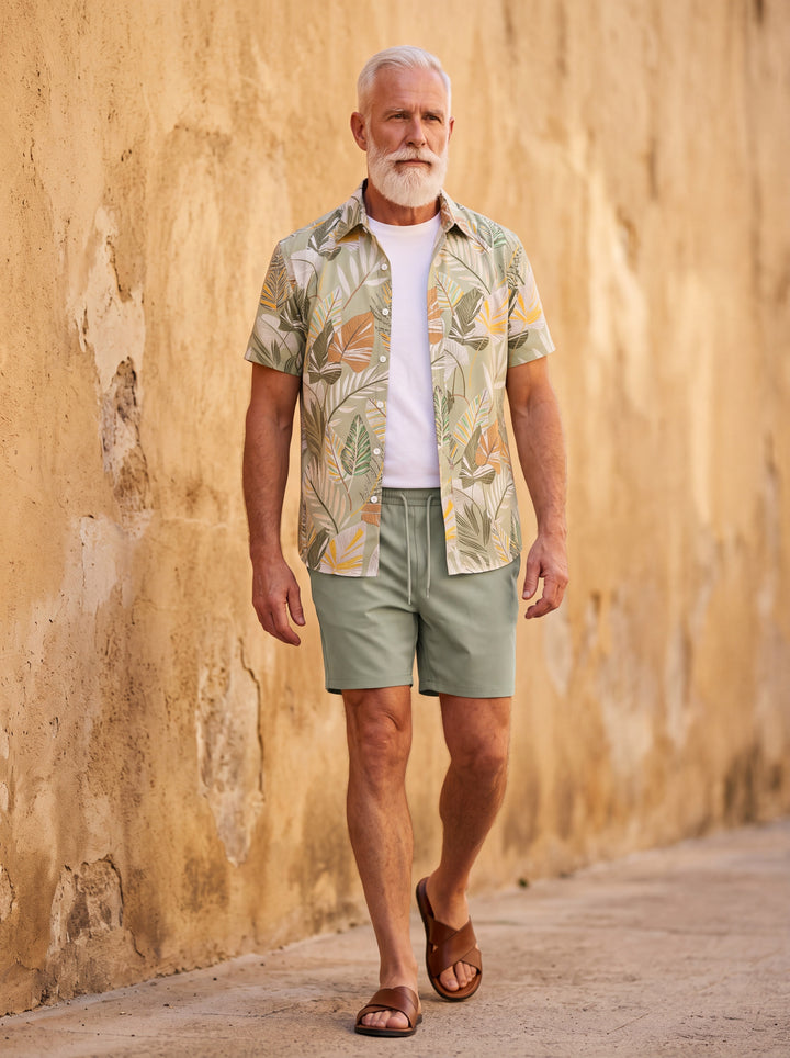 Griffin Men two-piece summer set in olive, worn by a model in a Mediterranean setting - Gentlemens Manor lifestyle