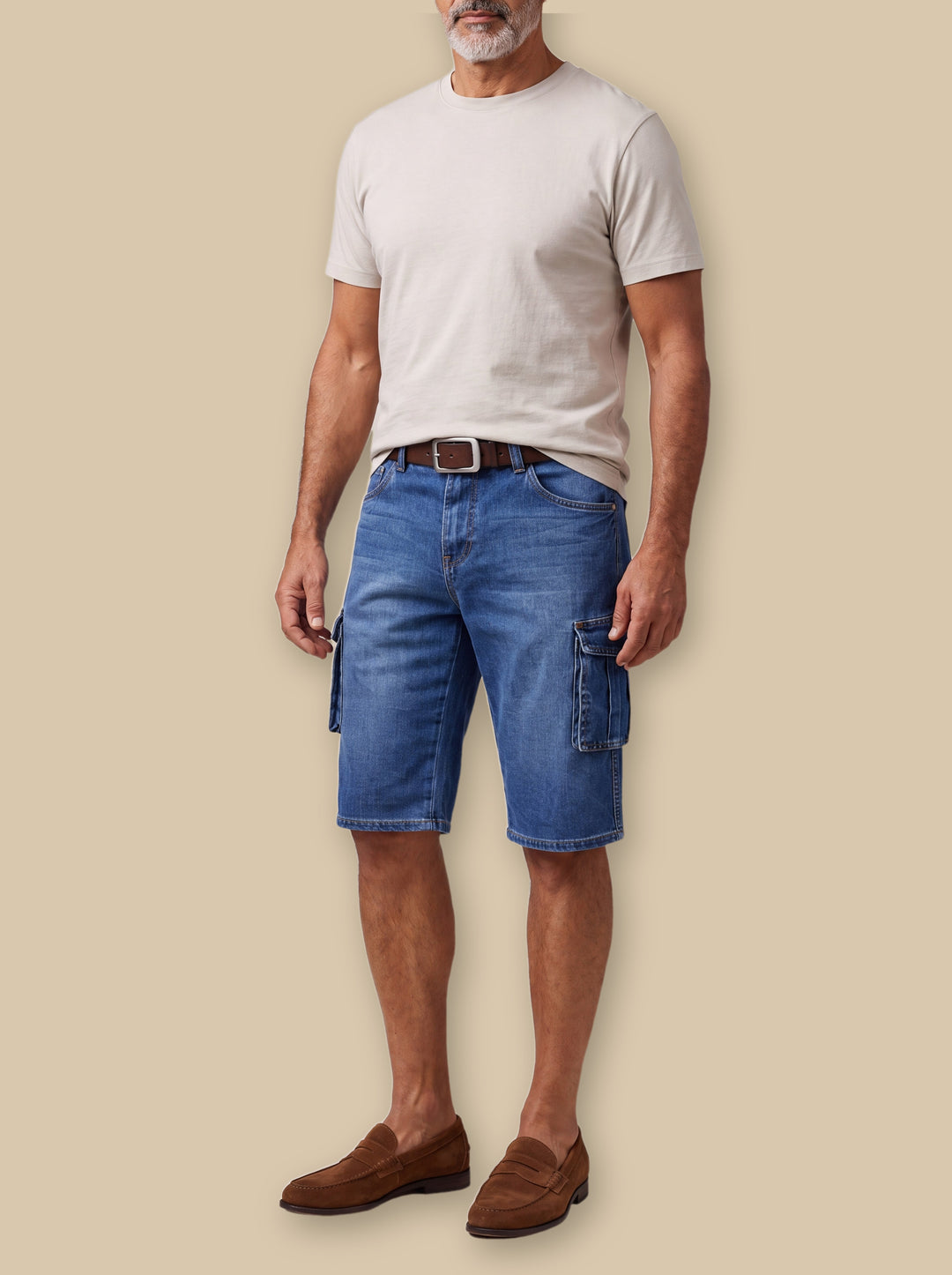 Grover summer shorts in Blue, worn by a model on a warm sand studio background - Gentlemens Manor