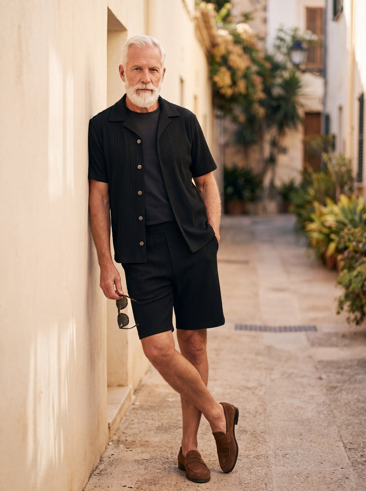 Grover Men two piece set in black, worn by a model on a Mediterranean terrace - Gentlemens Manor lifestyle