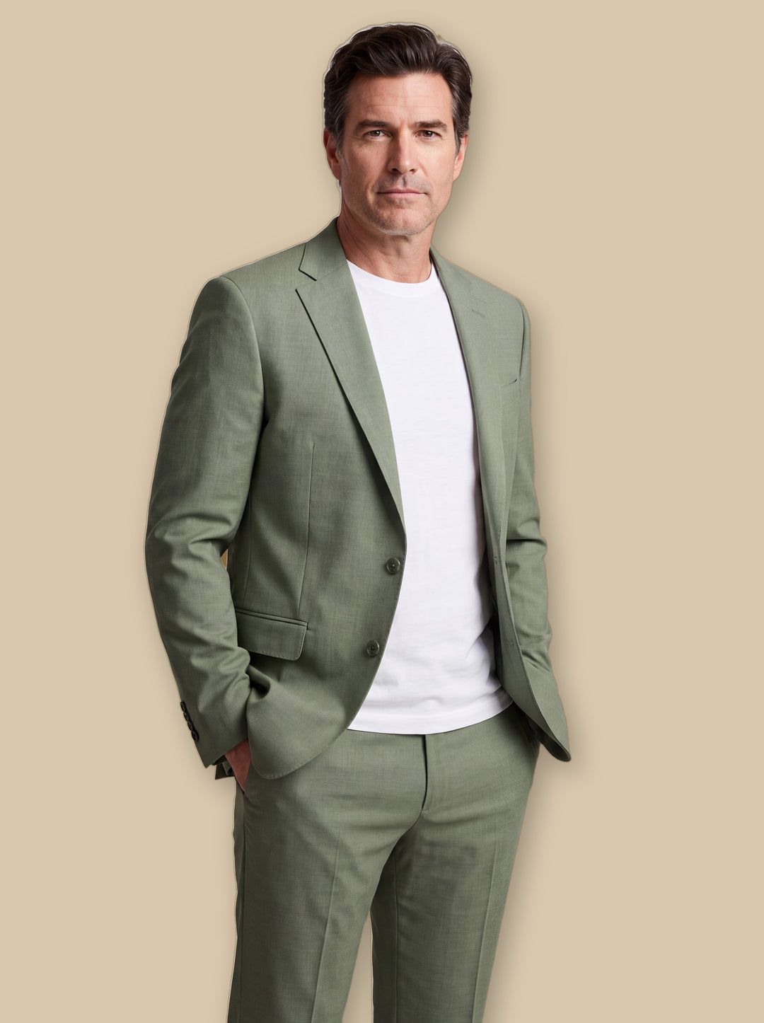 Guthrie blazer suit in Olive, worn by a model on a warm sand studio background - Gentlemens Manor