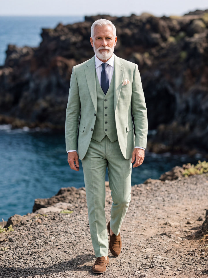 Guthrie Men three-piece suit in olive, worn by a model in a Mediterranean setting - Gentlemens Manor lifestyle