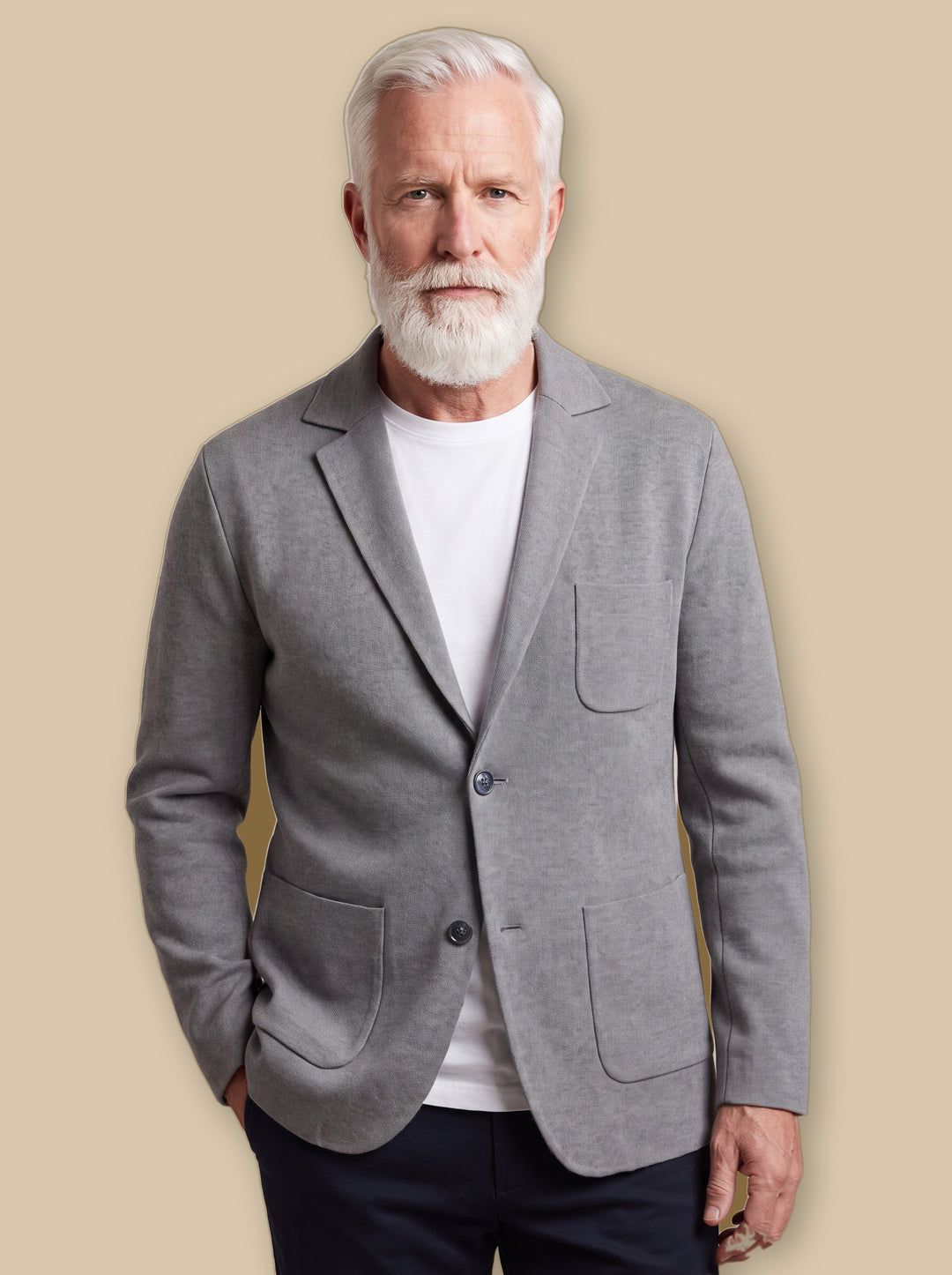 Hadley blazer suit in Grey, worn by a model on a warm sand studio background - Gentlemens Manor