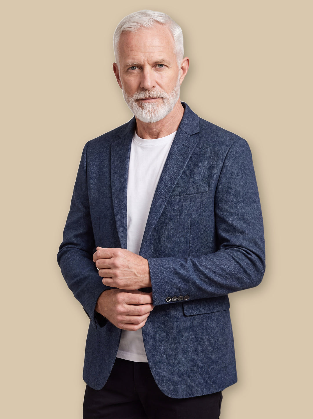 Hale blazer suit in Navy, worn by a model on a warm sand studio background - Gentlemens Manor