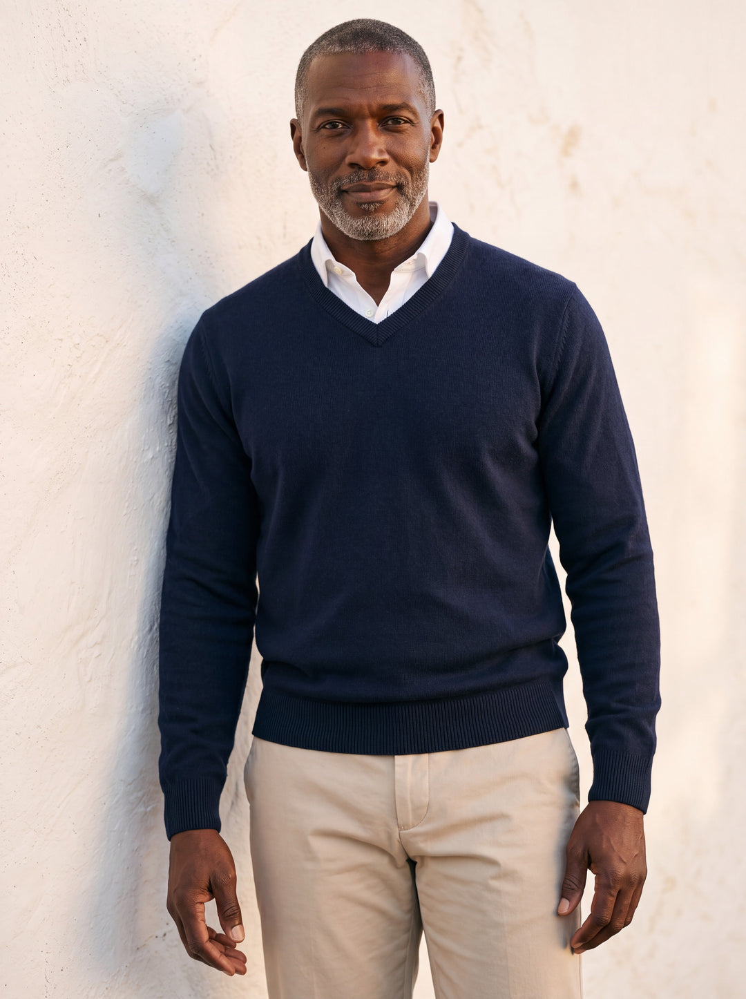Hamilton sweater in Navy, worn by a model in a Mediterranean setting - Gentlemens Manor lifestyle