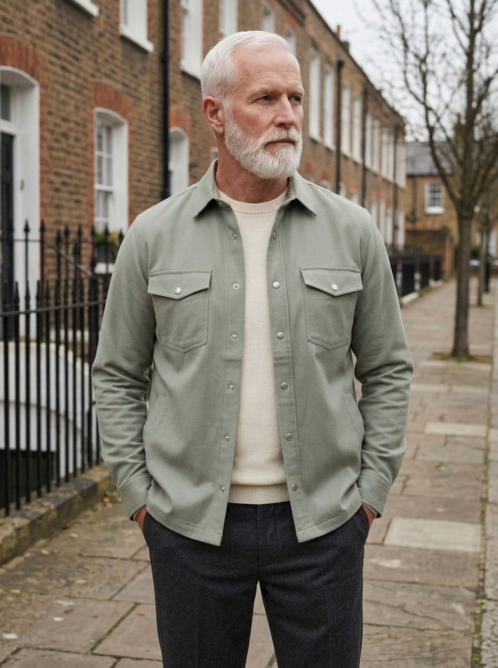 Hamlin overshirt in Sage, lifestyle on a street of brick row houses, Gentlemens Manor