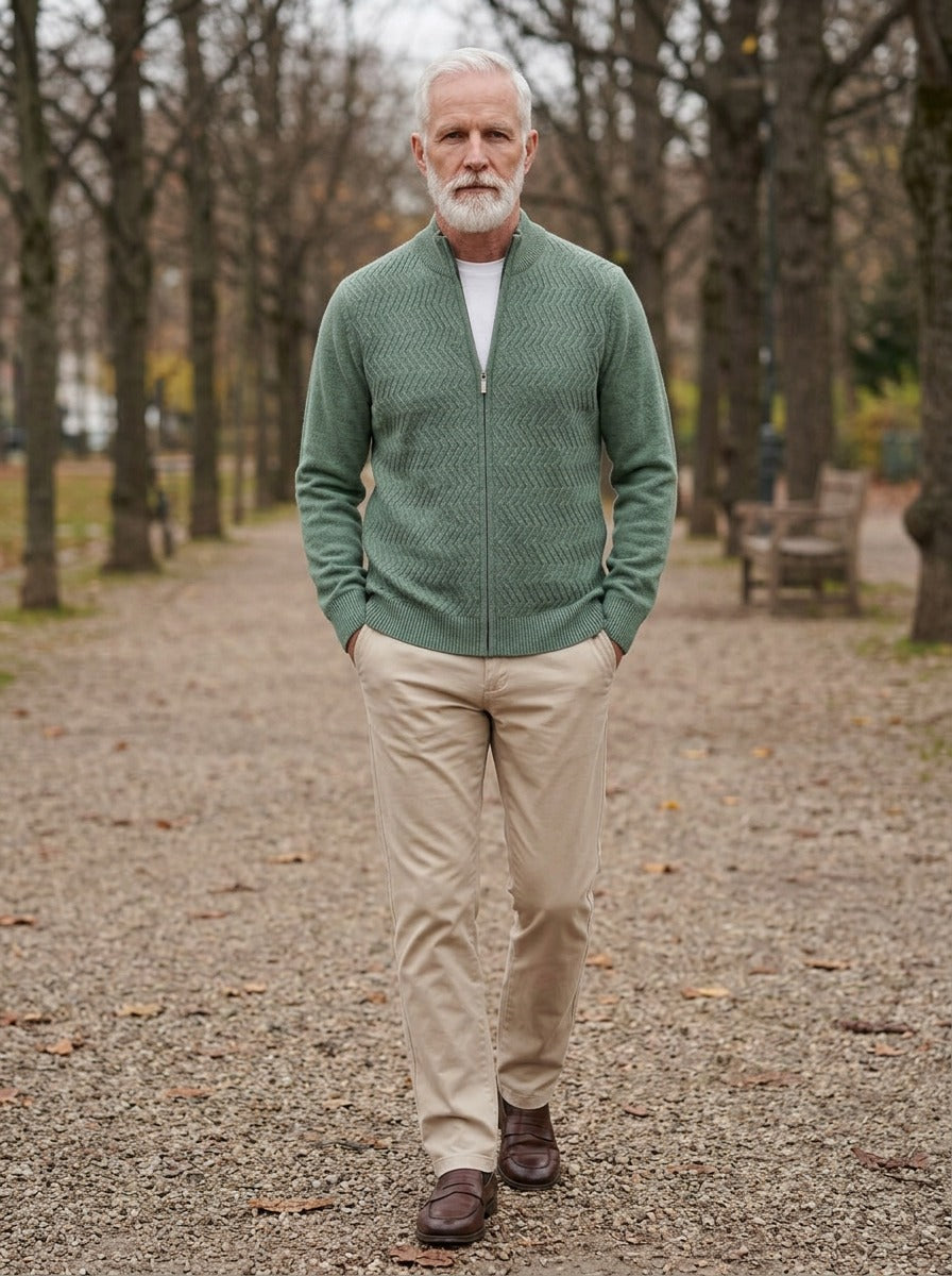 Hampton merino chevron zip cardigan in Sage, lifestyle on a park path, Gentlemens Manor