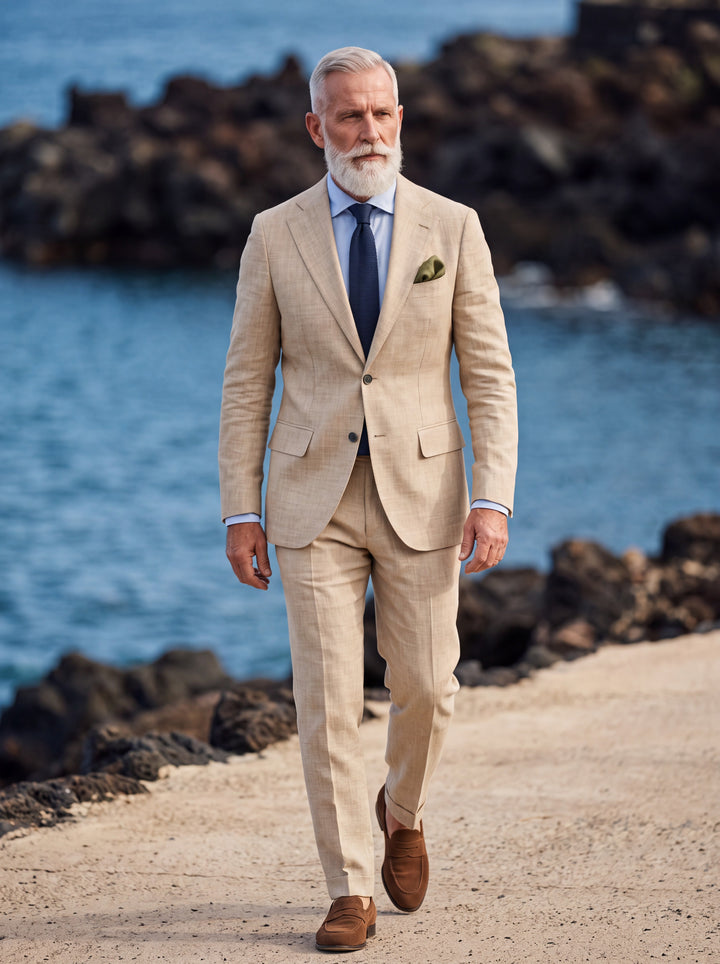 Hank Men two-piece suit in sand, worn by a model in a Mediterranean setting - Gentlemens Manor lifestyle