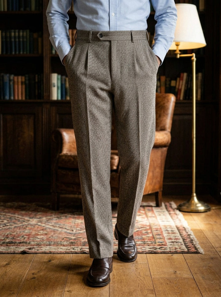 Harcourt herringbone pleated trousers in Brown, lifestyle in a private study, Gentlemens Manor
