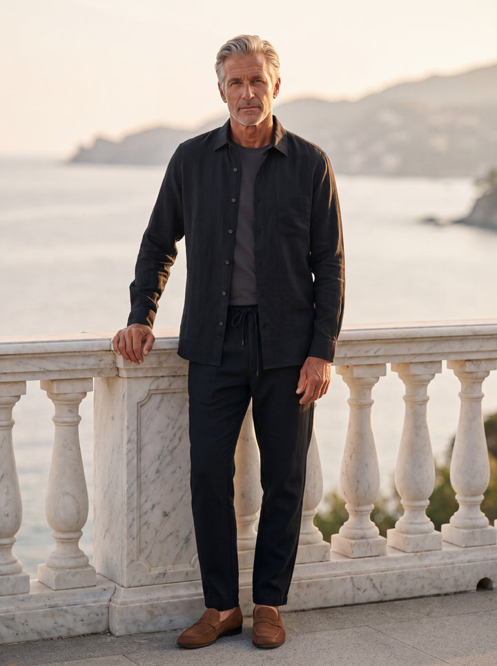 Hardy Men two piece set in black, worn by a model on a Mediterranean terrace - Gentlemens Manor lifestyle