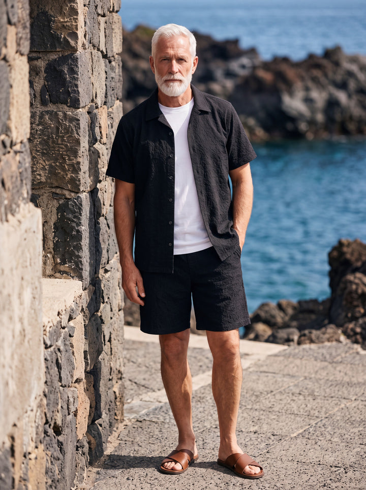 Harley Men two-piece summer set in black, worn by a model in a Mediterranean setting - Gentlemens Manor lifestyle