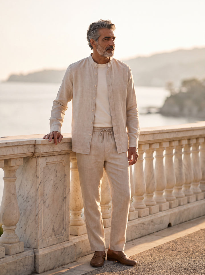 Harold Men two piece set in beige, worn by a model on a Mediterranean terrace - Gentlemens Manor lifestyle