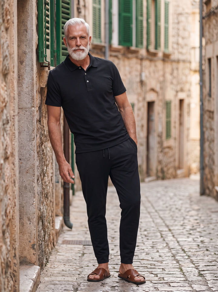 Harper Men two-piece summer set in black, worn by a model in a Mediterranean setting - Gentlemens Manor lifestyle