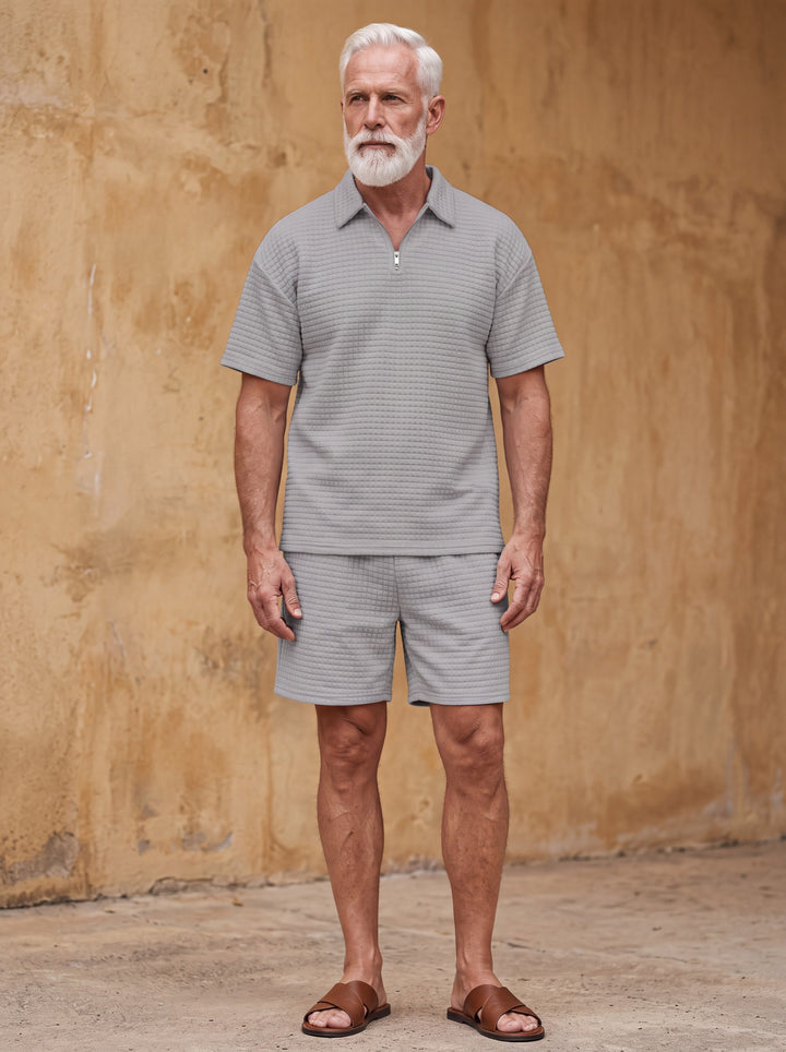 Harris Men two-piece summer set in grey, worn by a model in a Mediterranean setting - Gentlemens Manor lifestyle