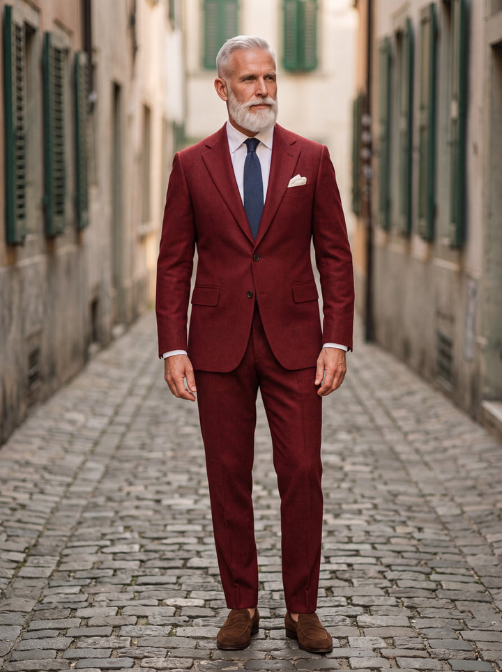 Harrison Men two-piece suit in red, worn by a model in a Mediterranean setting - Gentlemens Manor lifestyle
