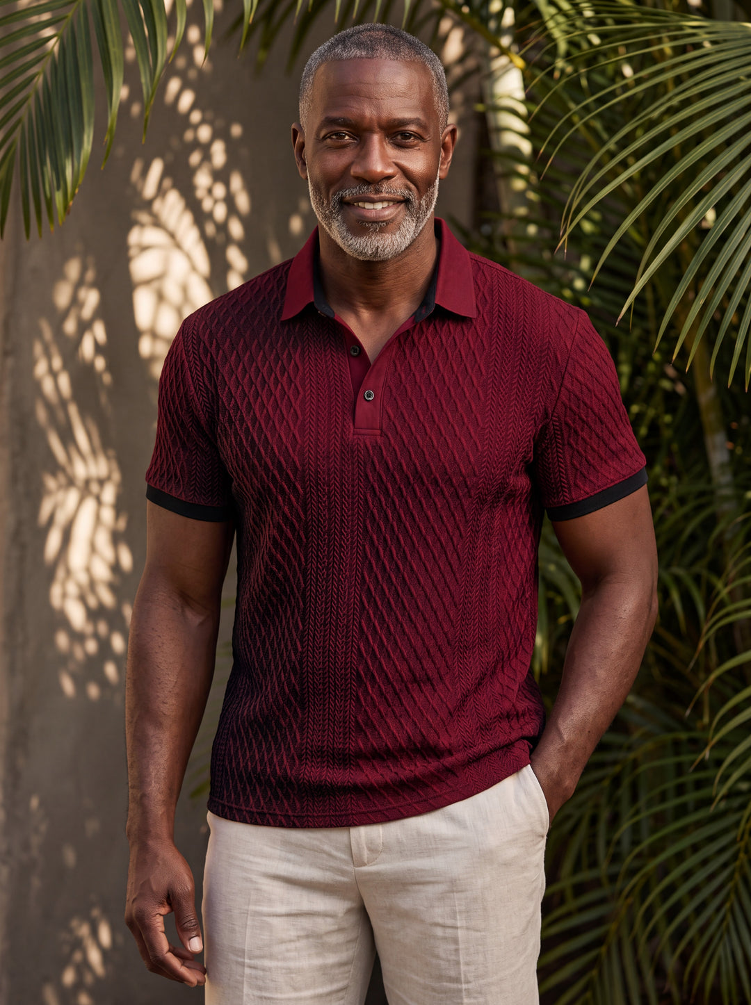 Harrison Men polo shirt in burgundy, worn by a model on a Mediterranean terrace - Gentlemens Manor lifestyle