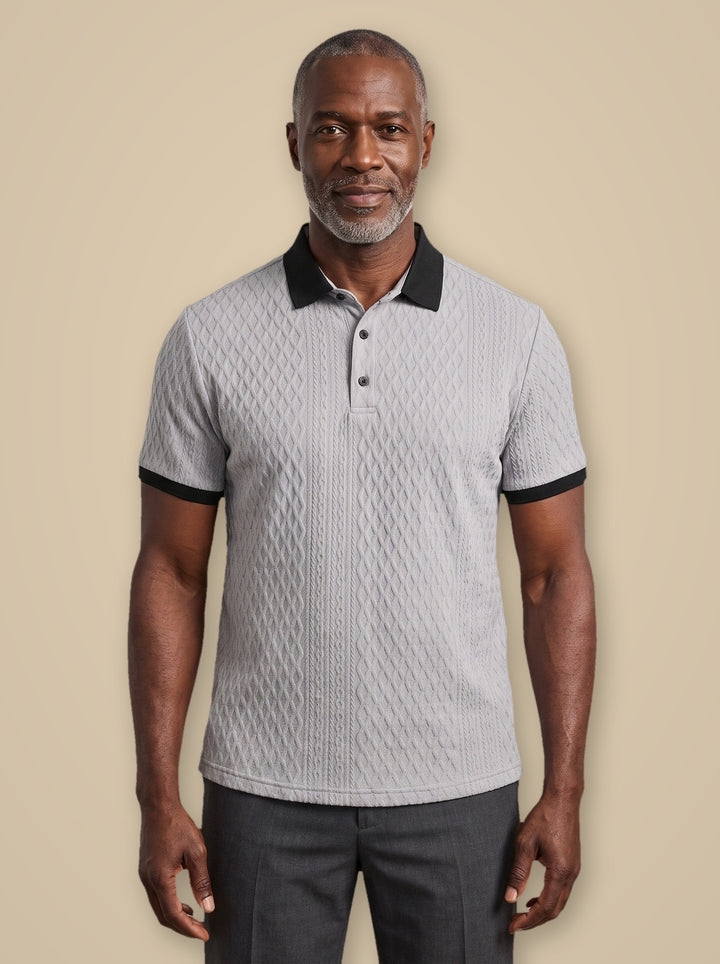 Harrison polo shirt in Grey, worn by a model on a warm taupe studio background - Gentlemens Manor