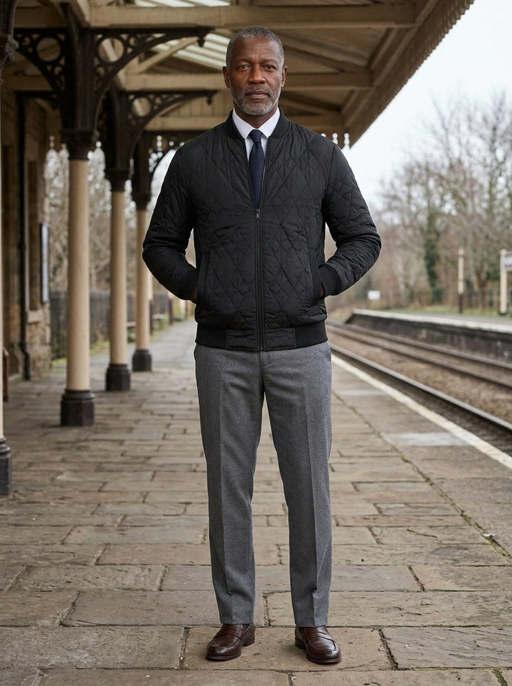 Haskell quilted bomber jacket in Black, lifestyle on a railway platform, Gentlemens Manor
