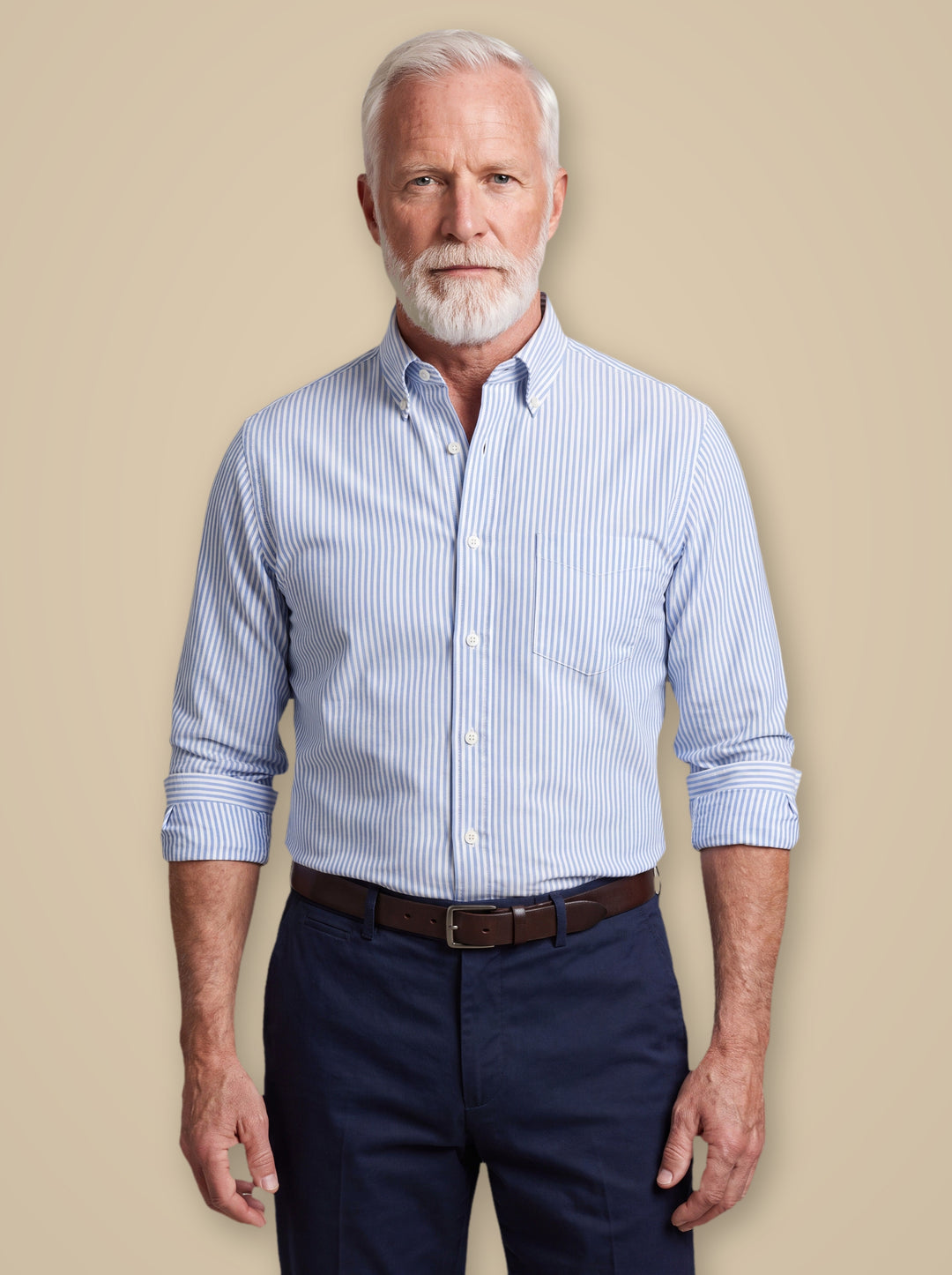 Hayes dress shirt in Light Blue, worn by a model on a warm taupe studio background - Gentlemens Manor