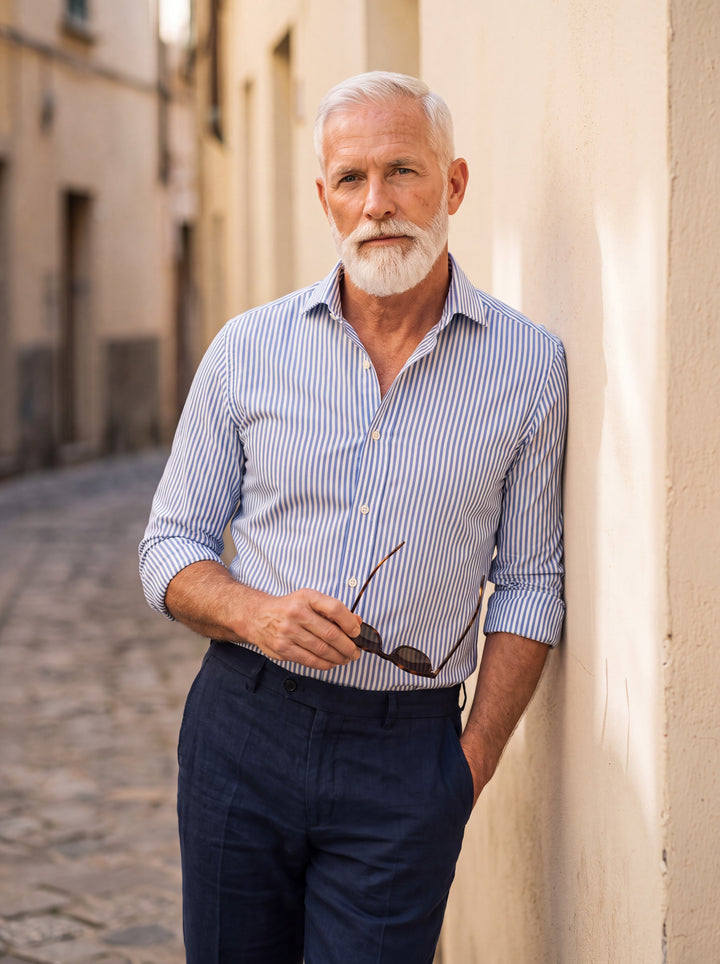 Hayes Men dress shirt in light blue, worn by a model on a Mediterranean terrace - Gentlemens Manor lifestyle