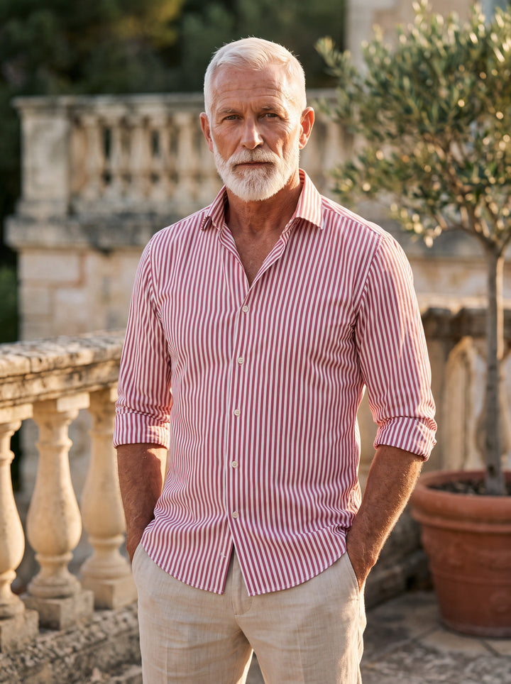 Hayes Men dress shirt in pink, worn by a model on a Mediterranean terrace - Gentlemens Manor lifestyle