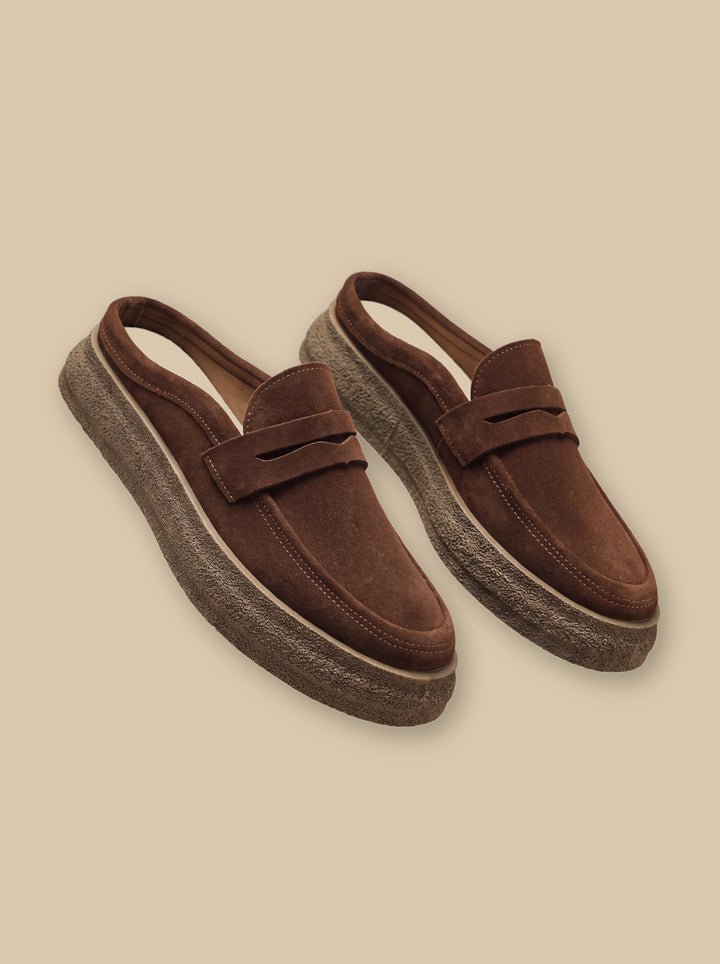 Hubert loafers in Brown, on a warm sand studio background - Gentlemens Manor