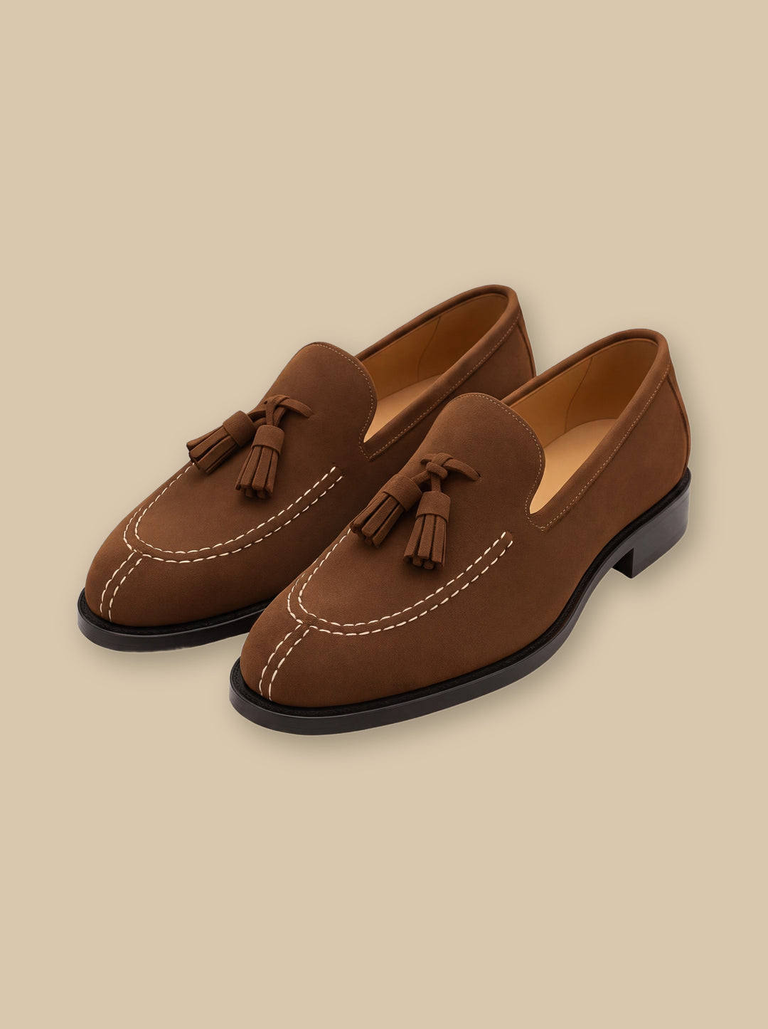Hunter loafers in Brown, on a warm sand studio background - Gentlemens Manor