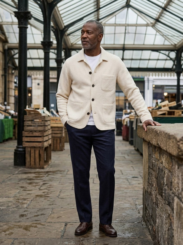 Hutton knit cardigan jacket in Cream, lifestyle in a covered market hall, Gentlemens Manor