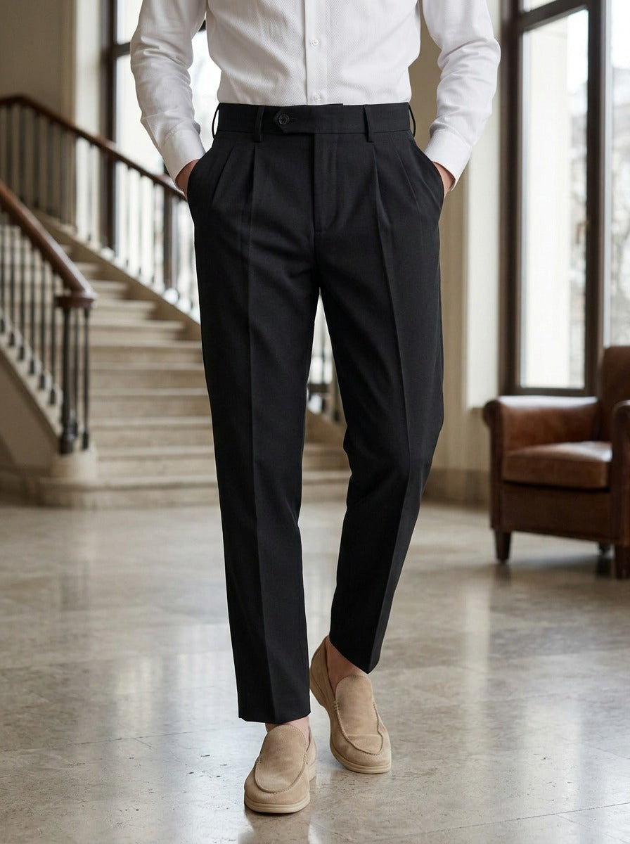 Huxley high waist pleated trousers in Black, lifestyle in a hotel lobby, Gentlemens Manor