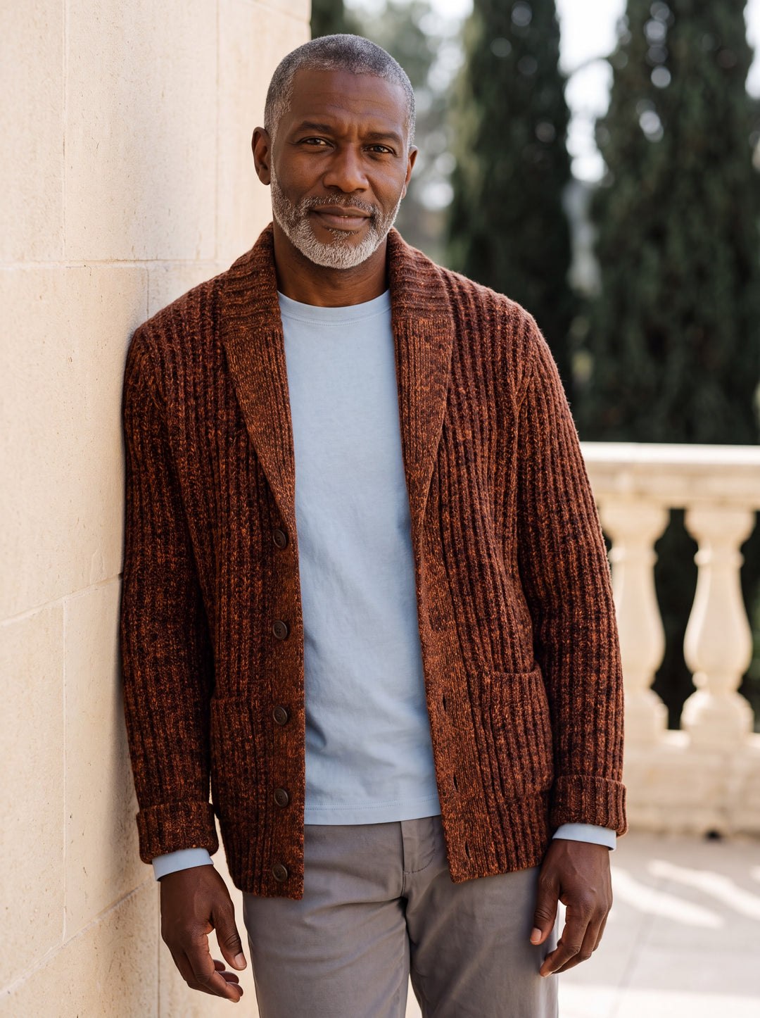 Irving cardigan in Brown, worn by a model in a Mediterranean setting - Gentlemens Manor lifestyle