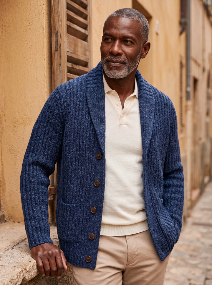 Irving cardigan in Navy, worn by a model in a Mediterranean setting - Gentlemens Manor lifestyle