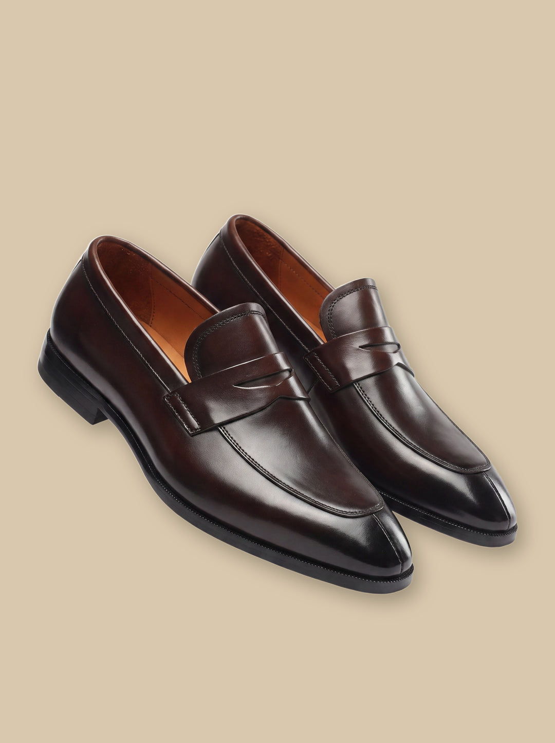 Irving loafers in Brown, on a warm sand studio background - Gentlemens Manor