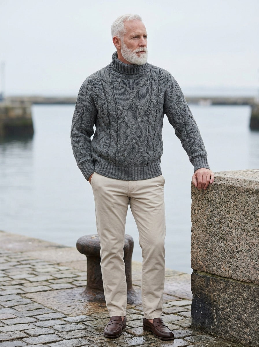 Keating chunky cable turtleneck sweater in Grey, lifestyle on a stone harbor quay, Gentlemens Manor
