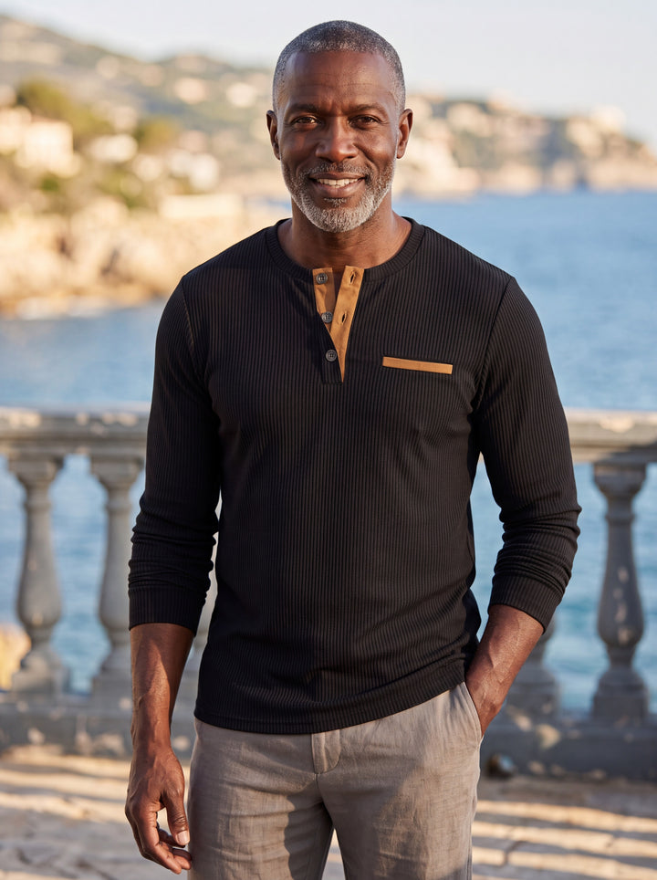 Kendall Men henley shirt in black, worn by a model on a Mediterranean terrace - Gentlemens Manor lifestyle