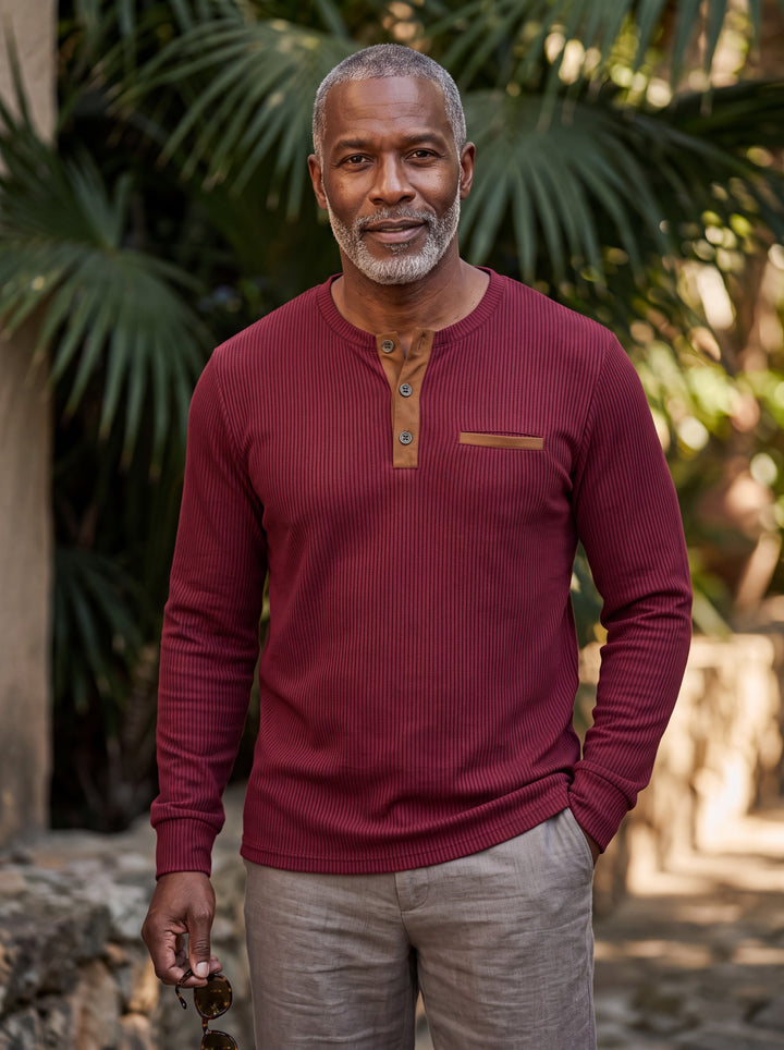 Kendall Men henley shirt in burgundy, worn by a model on a Mediterranean terrace - Gentlemens Manor lifestyle