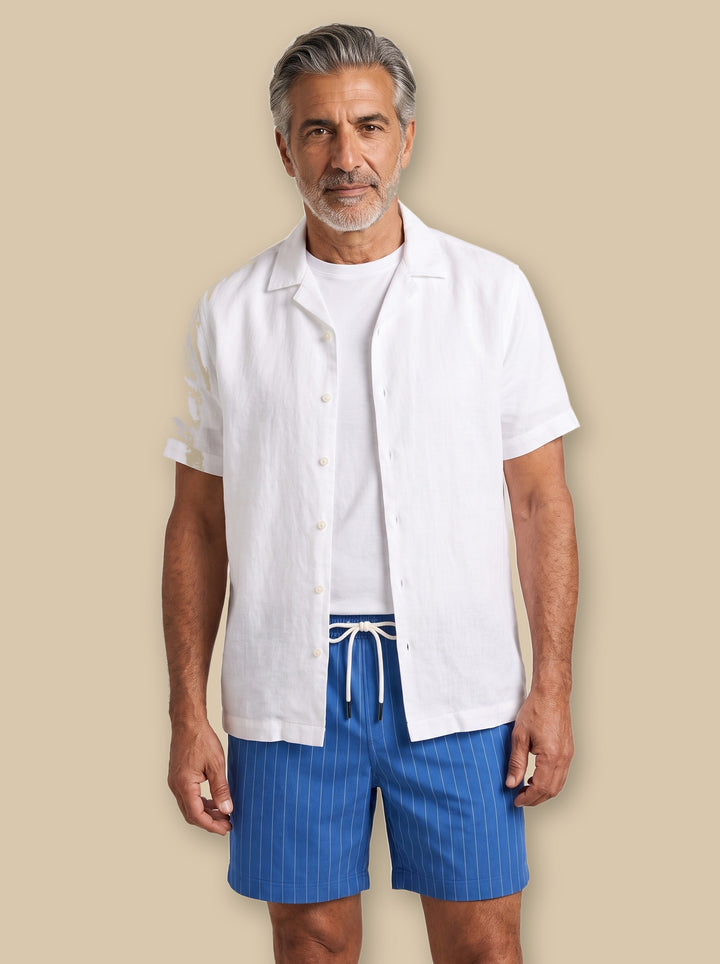 Kendrick summer shorts in Blue, worn by a model on a warm sand studio background - Gentlemens Manor