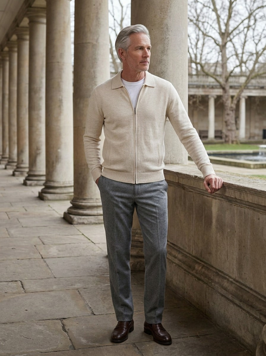 Lambeth spread collar zip cardigan in Cream, lifestyle in a stone colonnade, Gentlemens Manor
