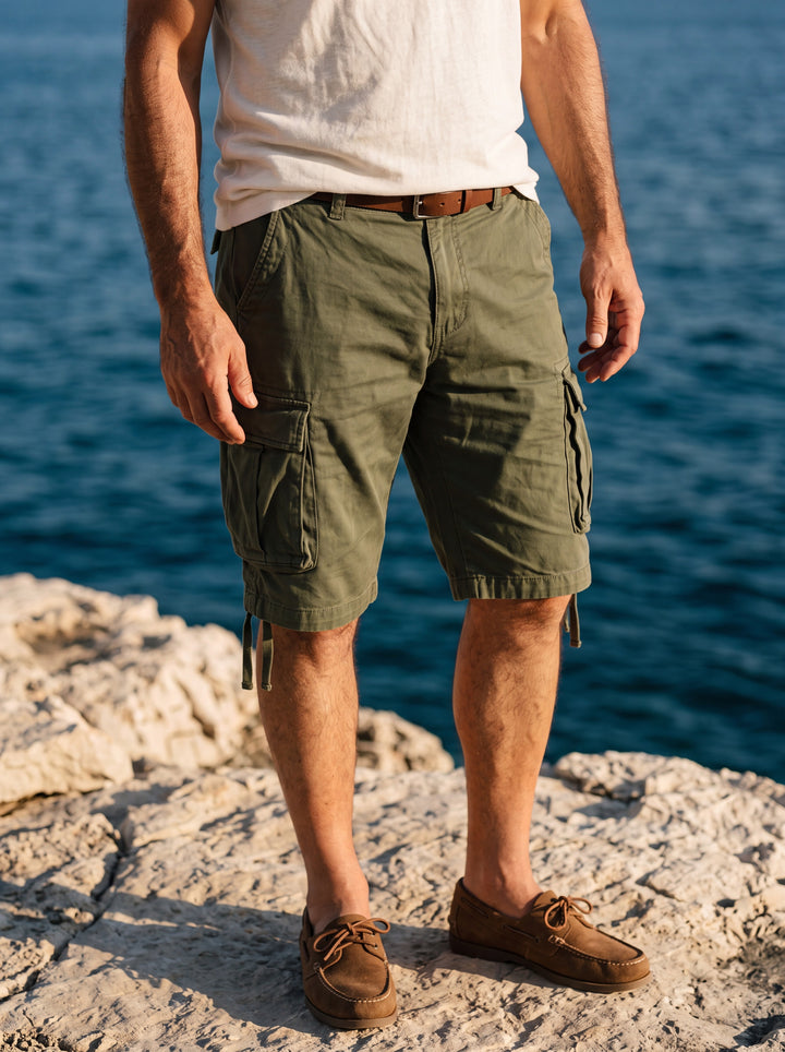 Lamont Men summer shorts in green, worn by a model in a Mediterranean setting - Gentlemens Manor lifestyle