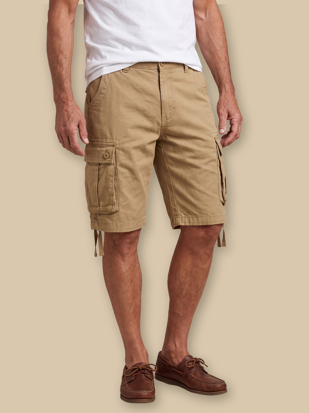 Lamont summer shorts in Sand, worn by a model on a warm sand studio background - Gentlemens Manor