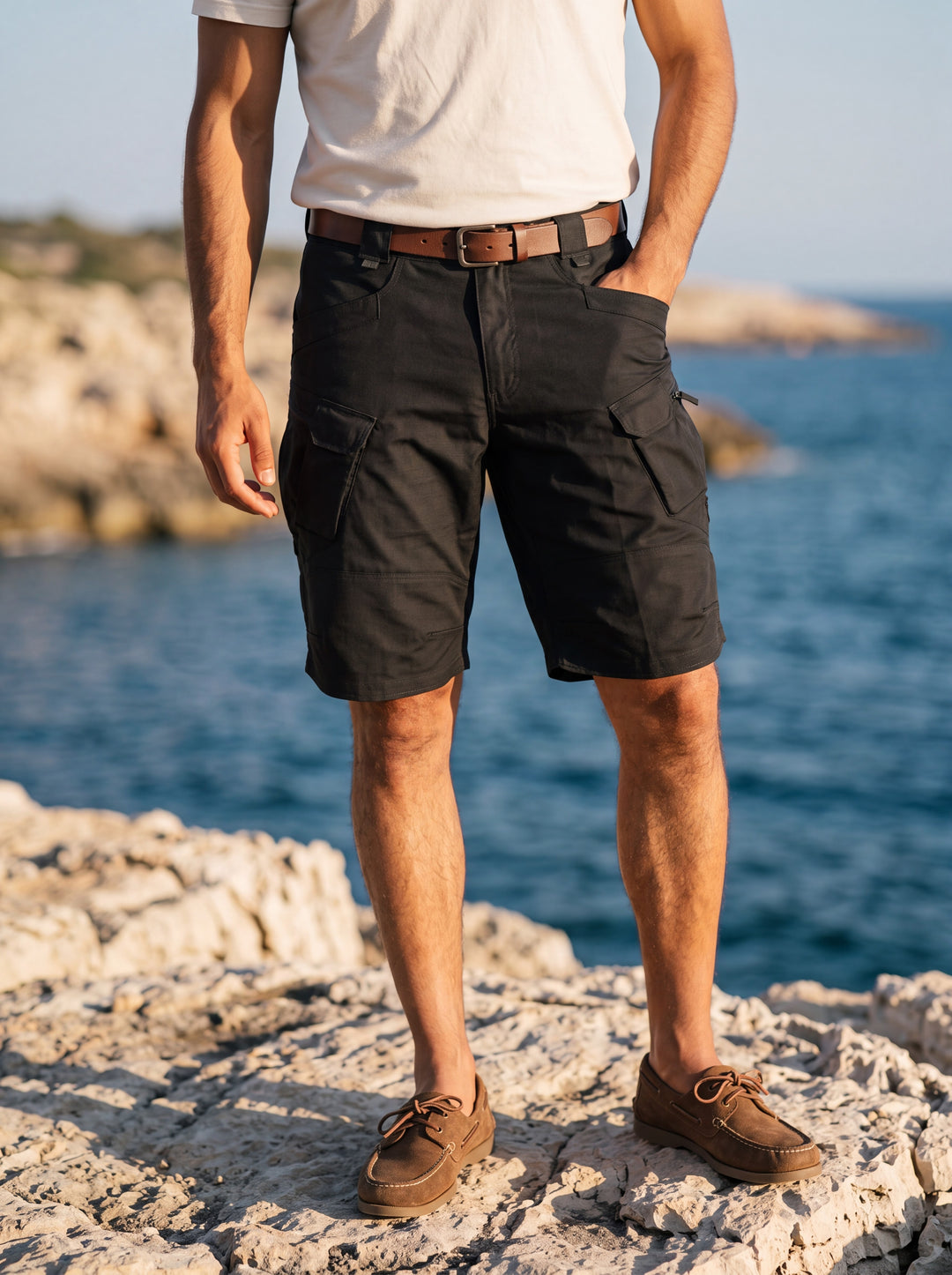 Landon Men summer shorts in black, worn by a model in a Mediterranean setting - Gentlemens Manor lifestyle