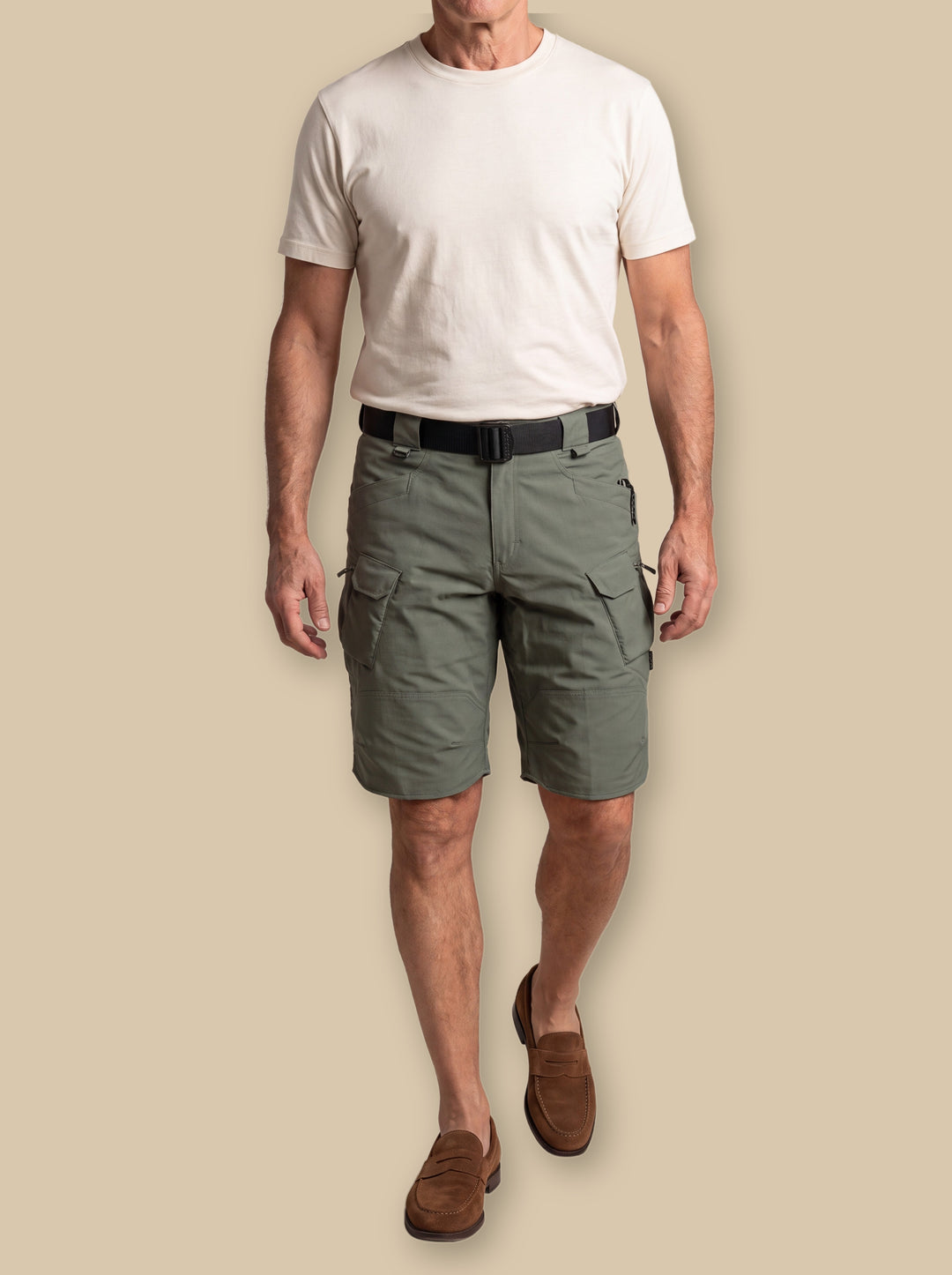 Landon summer shorts in Olive, worn by a model on a warm sand studio background - Gentlemens Manor