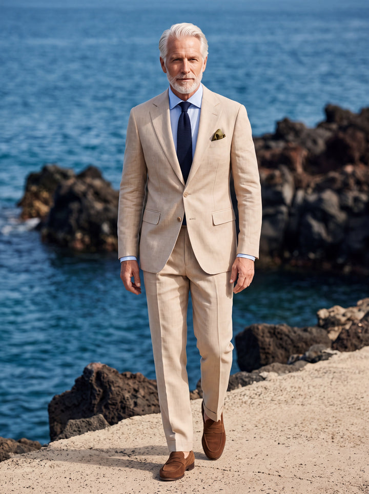 Langston Men two-piece suit in sand, worn by a model in a Mediterranean setting - Gentlemens Manor lifestyle